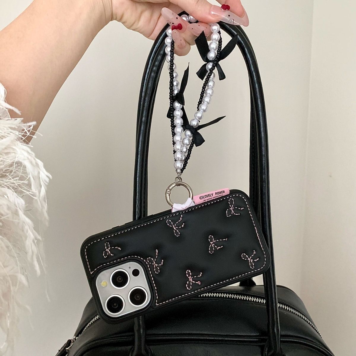 Black Back Cover with Bow Stitch Design and Beaded Strap for iPhone